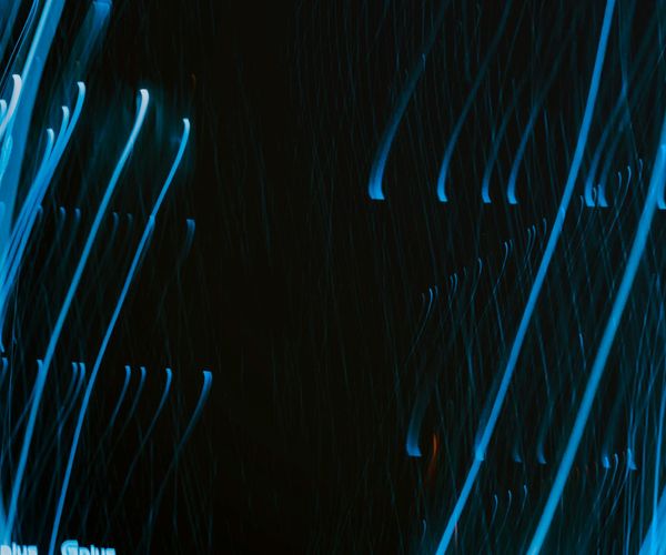 Abstract glowing lines on dark background representing focus